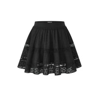 A black flared skirt with a textured pattern and sheer lace panels near the hem, shown against a plain white background.