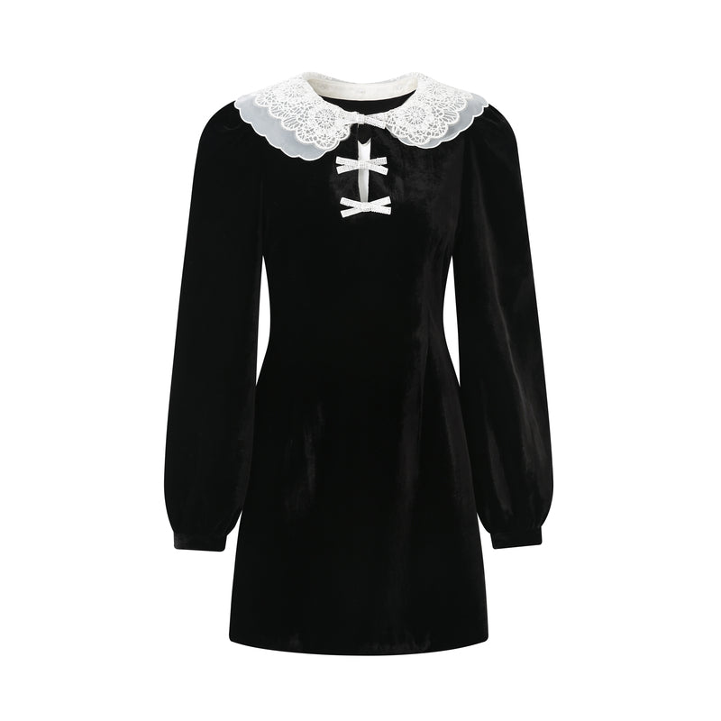 Model wearing a lace doll collar velvet dress in Black