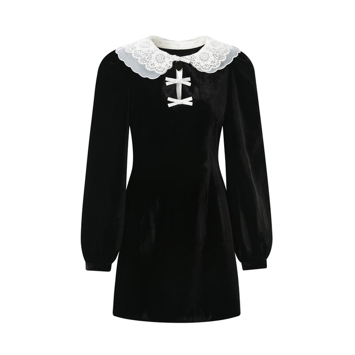 Model wearing a lace doll collar velvet dress in Black
